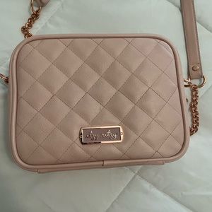 Itsy Ritsy crossbody mini diaper bag.